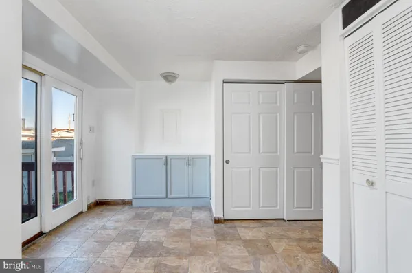 an empty room with closet area