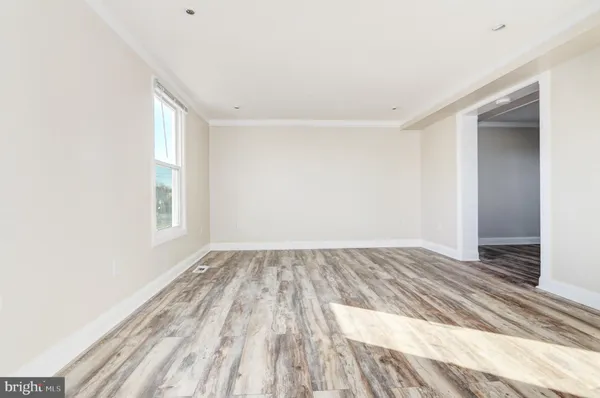 a view of an empty room and window