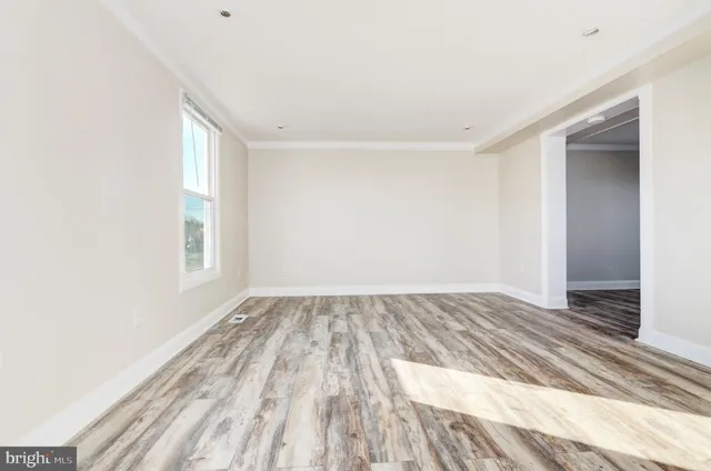 a view of an empty room and window