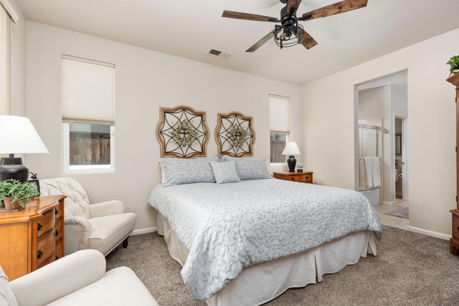 3942 Harlan Ranch Boulevard Clovis, CA 93619 - Photo 11 of 21 a bedroom with a bed couch and window