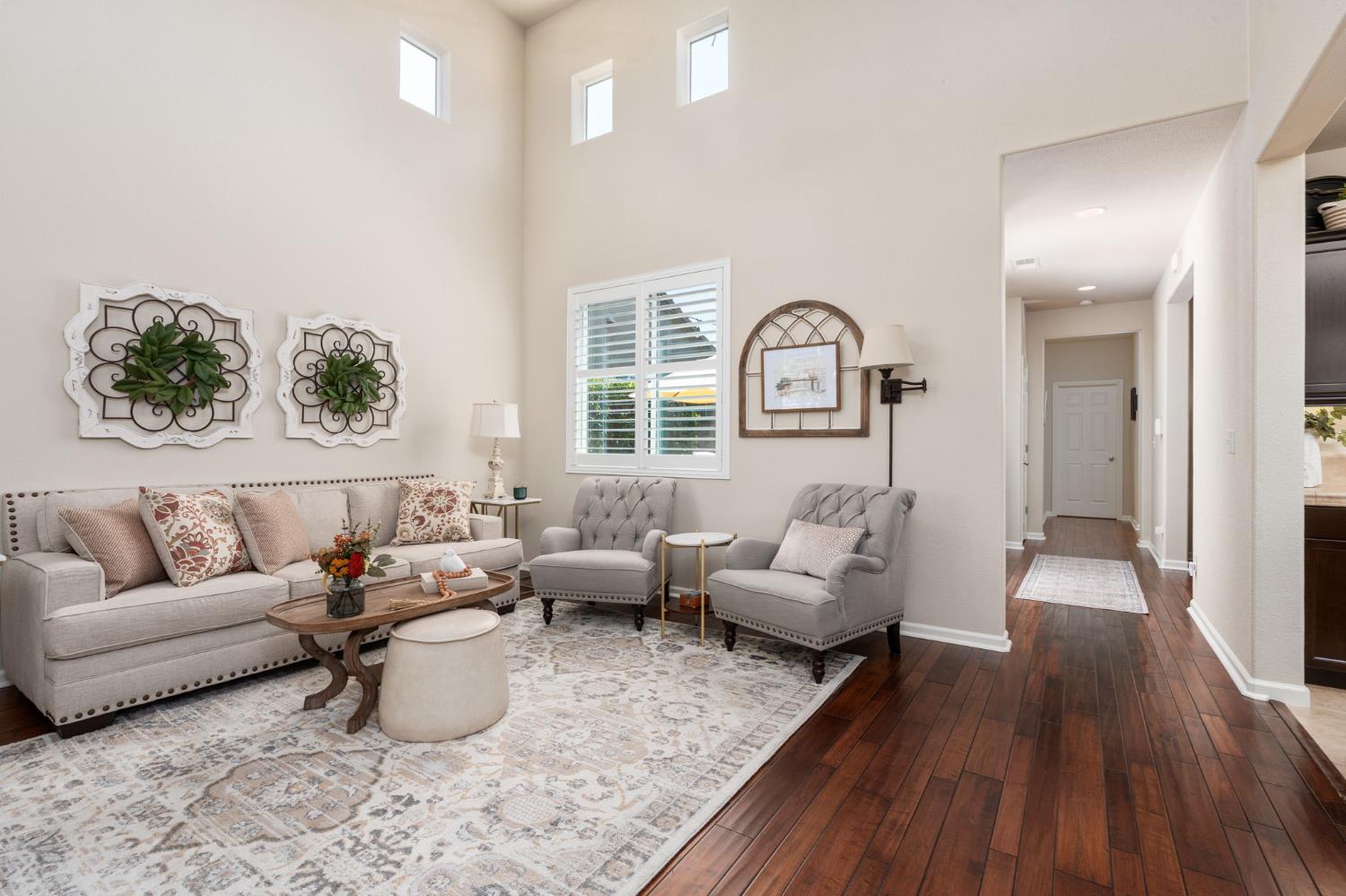 3942 Harlan Ranch Boulevard Clovis, CA 93619 - Photo 6 of 21 a living room with furniture and wooden floor