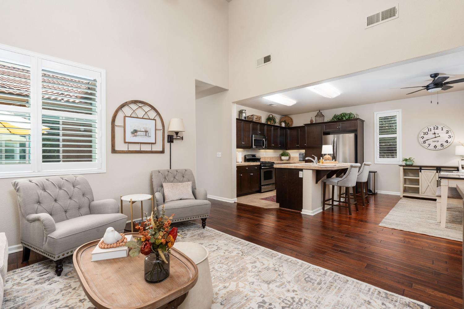 3942 Harlan Ranch Boulevard Clovis, CA 93619 - Photo 7 of 21 a living room with furniture and wooden floor
