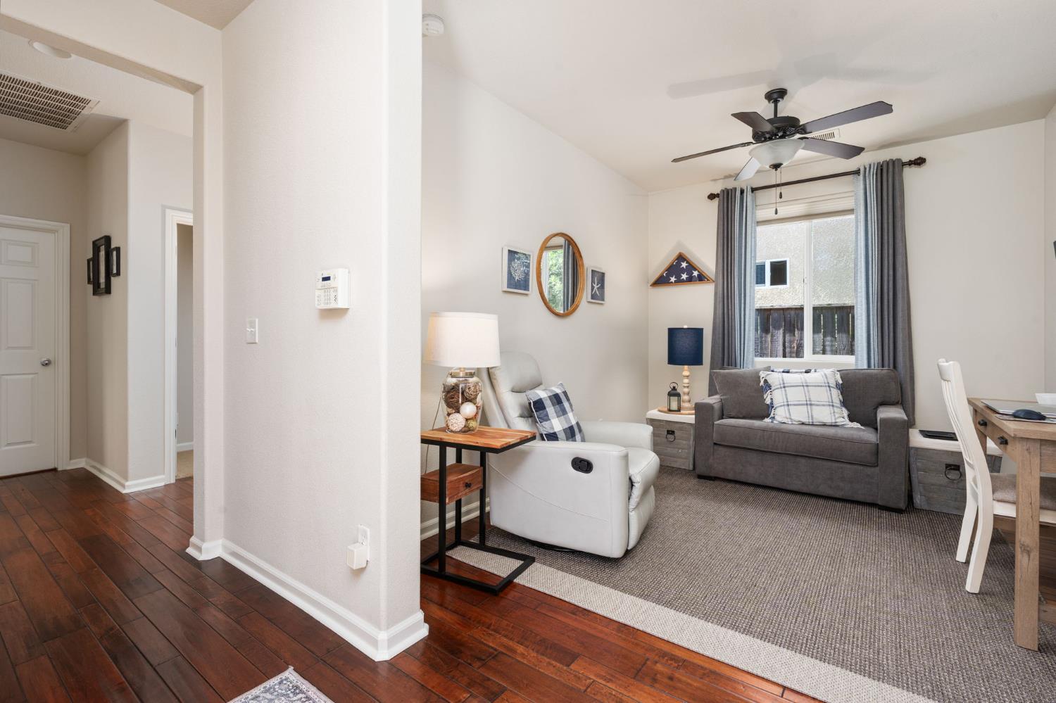 3942 Harlan Ranch Boulevard Clovis, CA 93619 - Photo 8 of 21 a living room with furniture and a window
