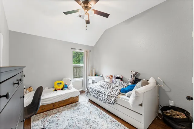 a bedroom with furniture and a window