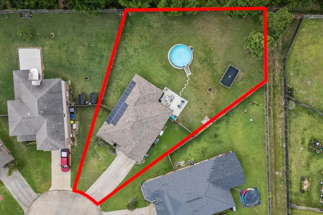 swimming pool with outdoor seating and yard