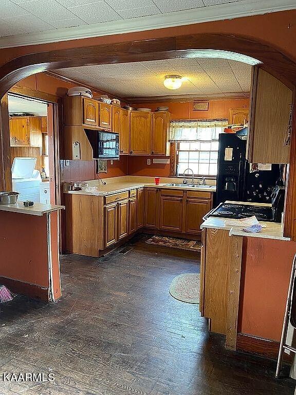 4135 Sidonia Road Sharon, TN 38255 - Photo 2 of 13 a kitchen with stove and cabinets