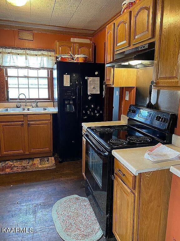 4135 Sidonia Road Sharon, TN 38255 - Photo 3 of 13 a kitchen with granite countertop a stove and a sink