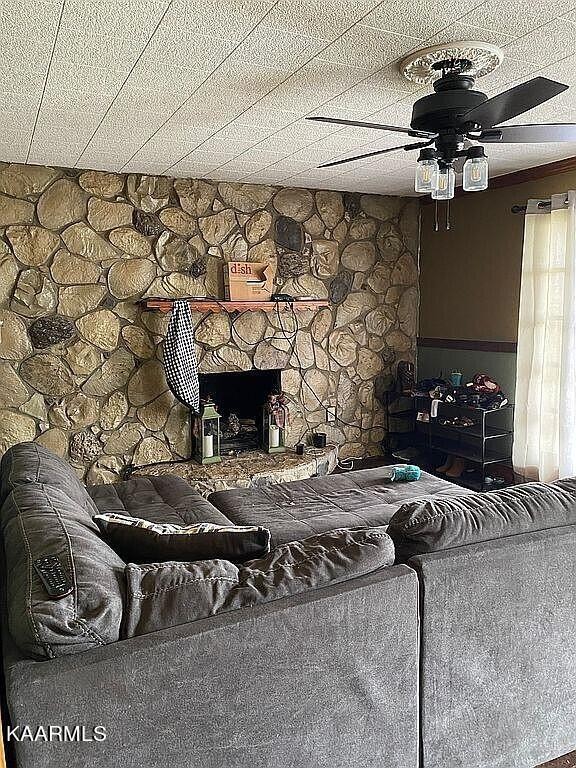 4135 Sidonia Road Sharon, TN 38255 - Photo 5 of 13 a living room with furniture and a fireplace