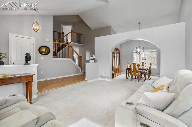 a living room with furniture and white walls