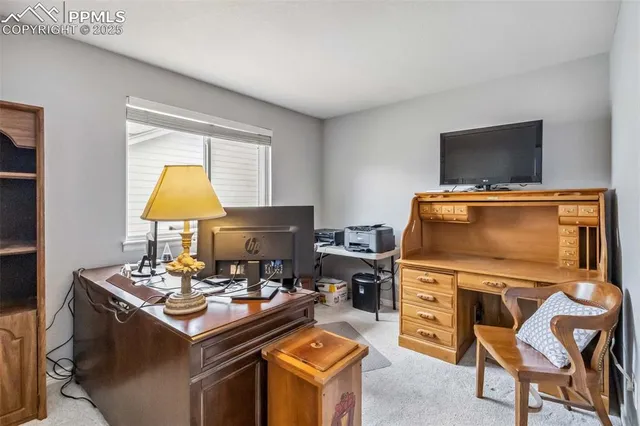 a view of a workspace with furniture