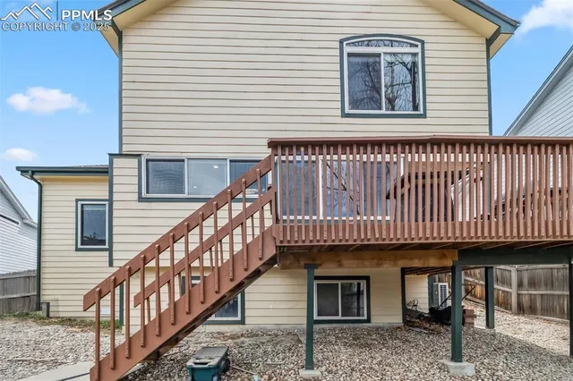 a front view of a house with wooden stairs