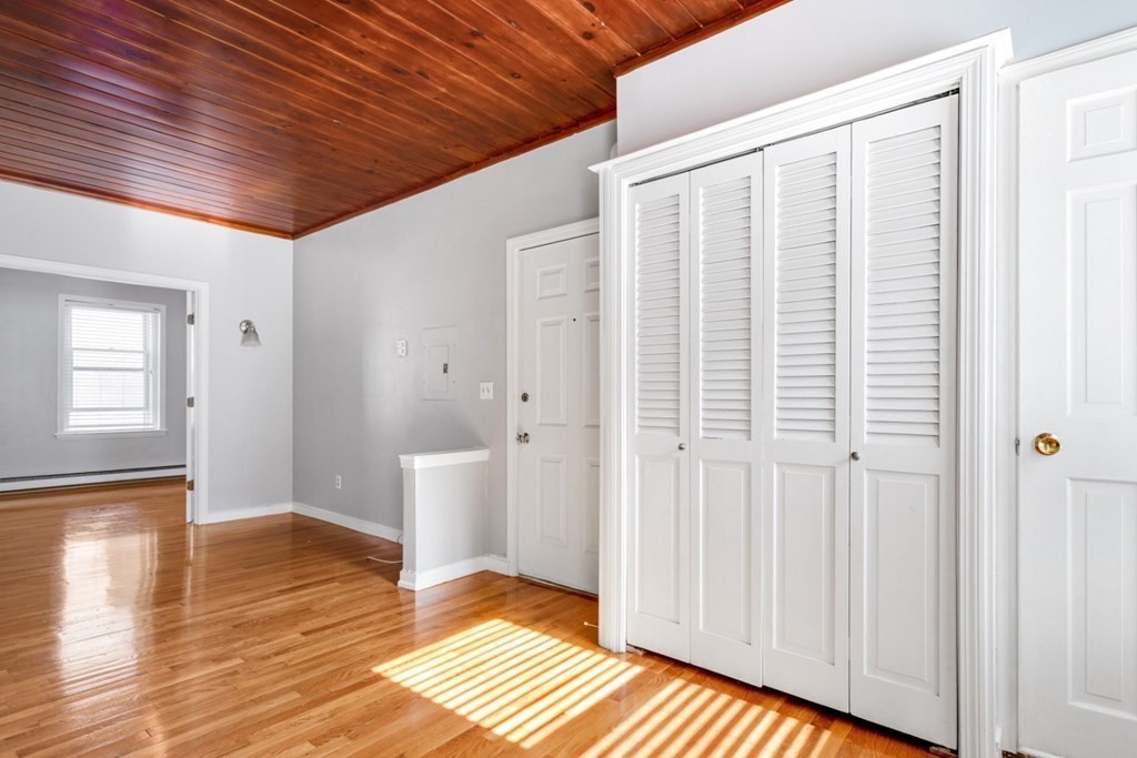 72 North Margin Street Boston, MA 02113 - Photo 11 of 42 a view of an empty room with wooden floor and a window