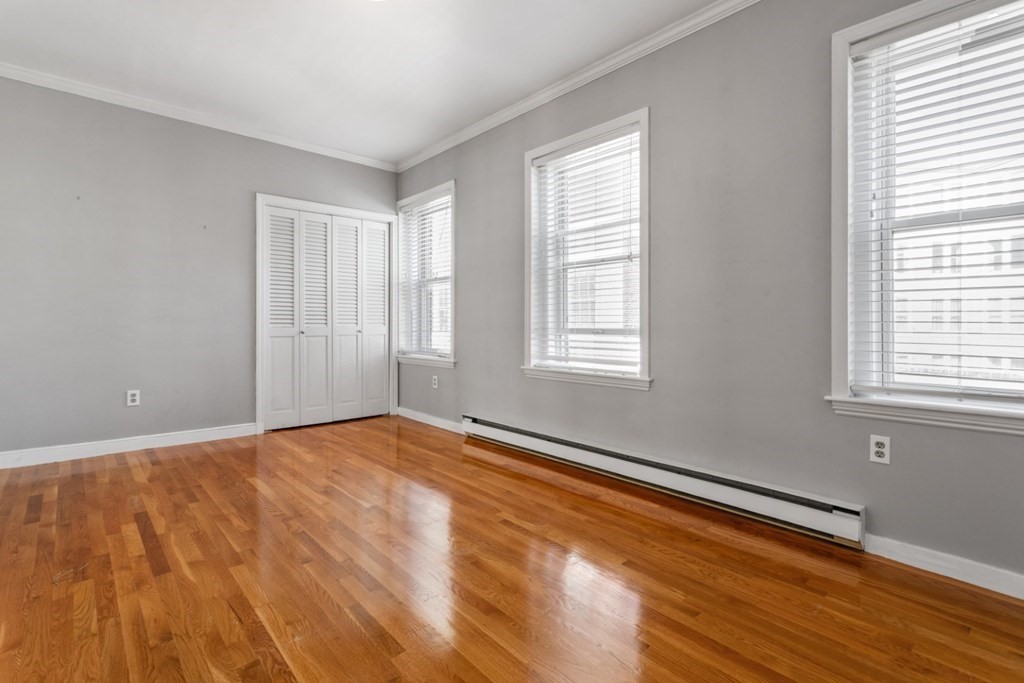 72 North Margin Street Boston, MA 02113 - Photo 12 of 42 a view of an empty room with wooden floor and a window