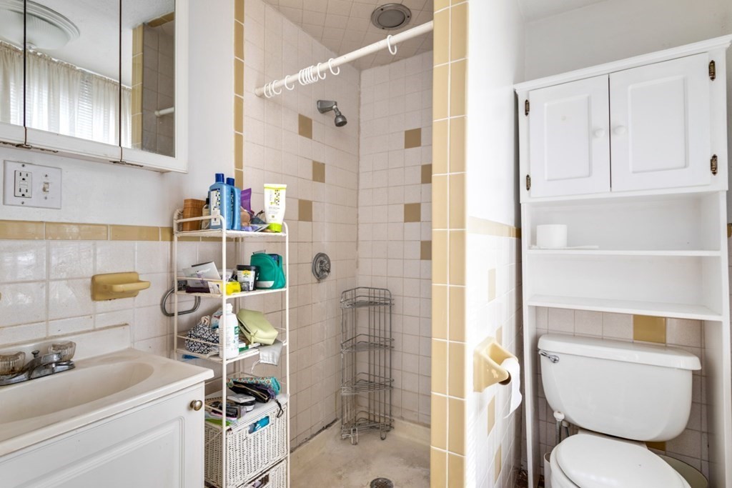 72 North Margin Street Boston, MA 02113 - Photo 25 of 42 a bathroom with a sink toilet and shower