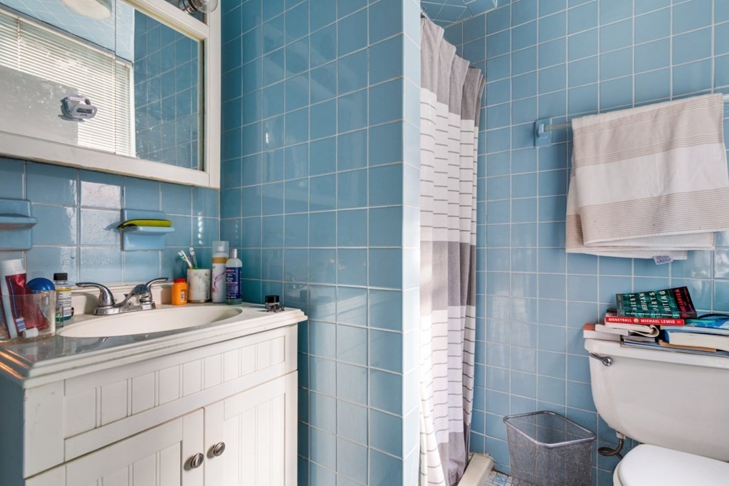 72 North Margin Street Boston, MA 02113 - Photo 28 of 42 a bathroom with a sink toilet and a shower