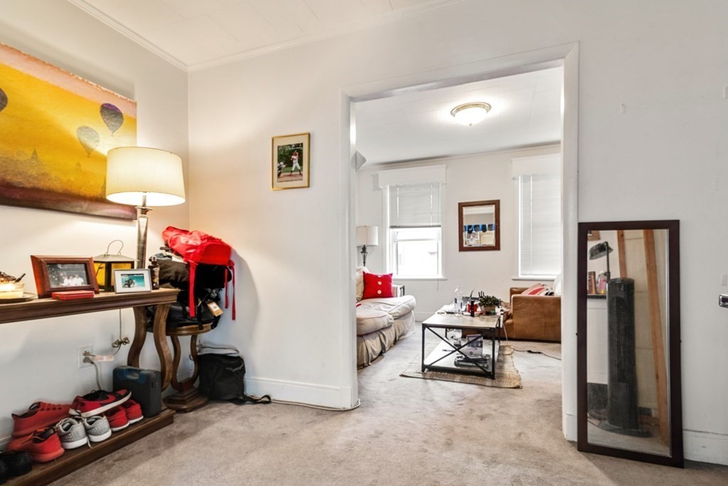 72 North Margin Street Boston, MA 02113 - Photo 29 of 42 a living room with lots of furniture and a gym equipment