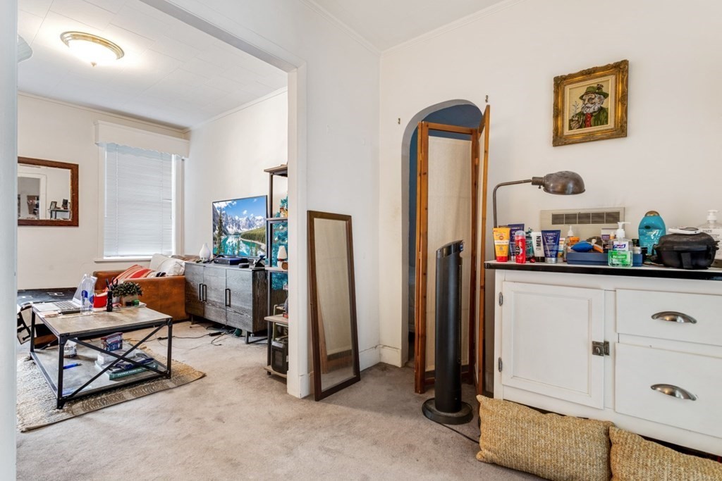 72 North Margin Street Boston, MA 02113 - Photo 30 of 42 a living room with furniture and a flat screen tv