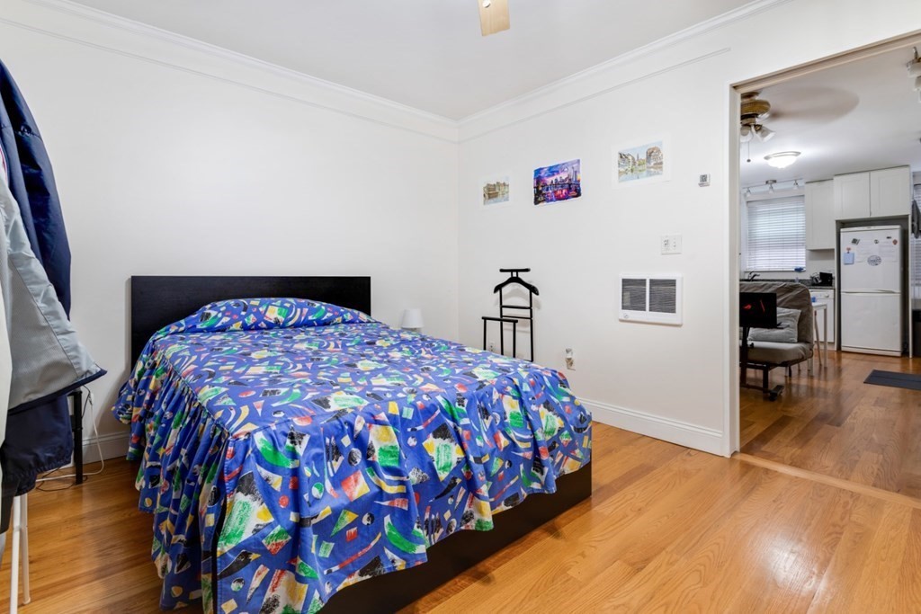 72 North Margin Street Boston, MA 02113 - Photo 37 of 42 a bedroom with a bed and a table in it