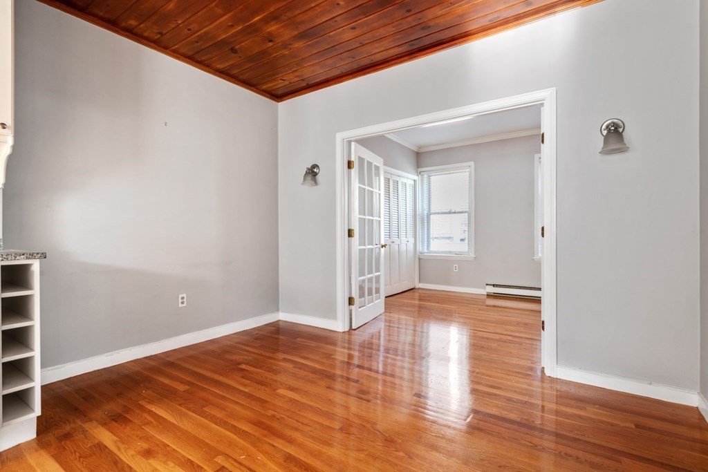 72 North Margin Street Boston, MA 02113 - Photo 8 of 42 a view of empty room with wooden floor and fan
