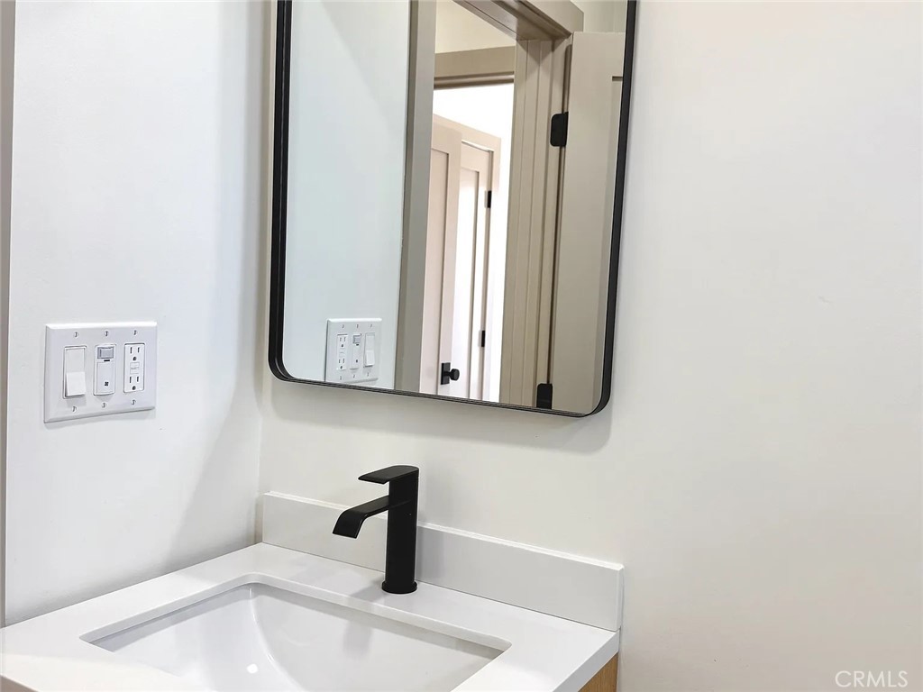 2510 Termino Avenue, Unit B Long Beach, CA 90815 - Photo 18 of 22 a bathroom with a sink and a mirror