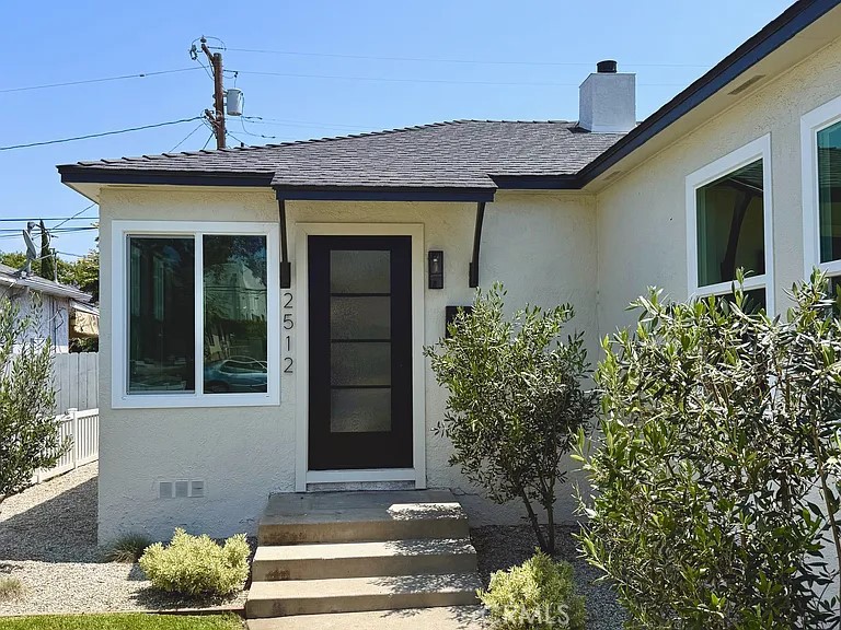 2510 Termino Avenue, Unit B Long Beach, CA 90815 - Photo 2 of 22 a front view of a house with a yard