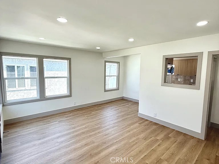 2510 Termino Avenue, Unit B Long Beach, CA 90815 - Photo 9 of 22 a view of empty room with wooden floor and fan