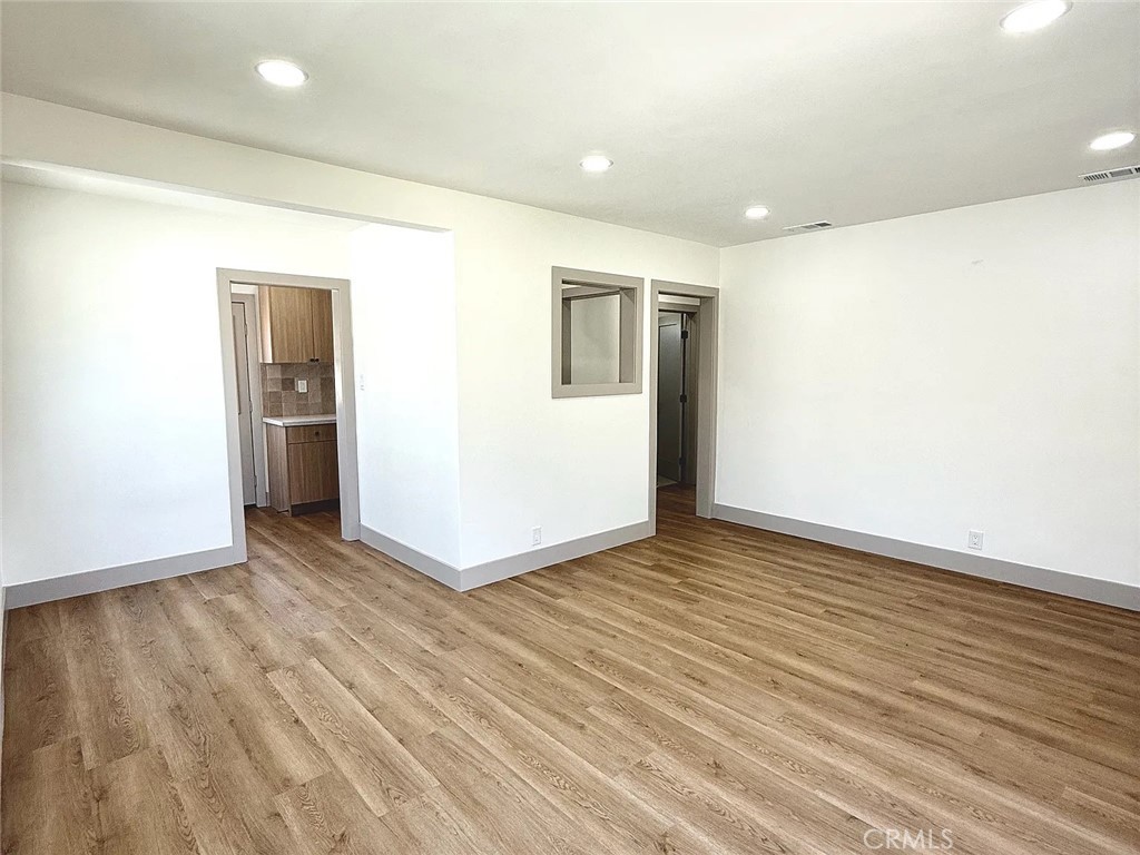 2510 Termino Avenue, Unit B Long Beach, CA 90815 - Photo 10 of 22 an empty room with wooden floor and entrance