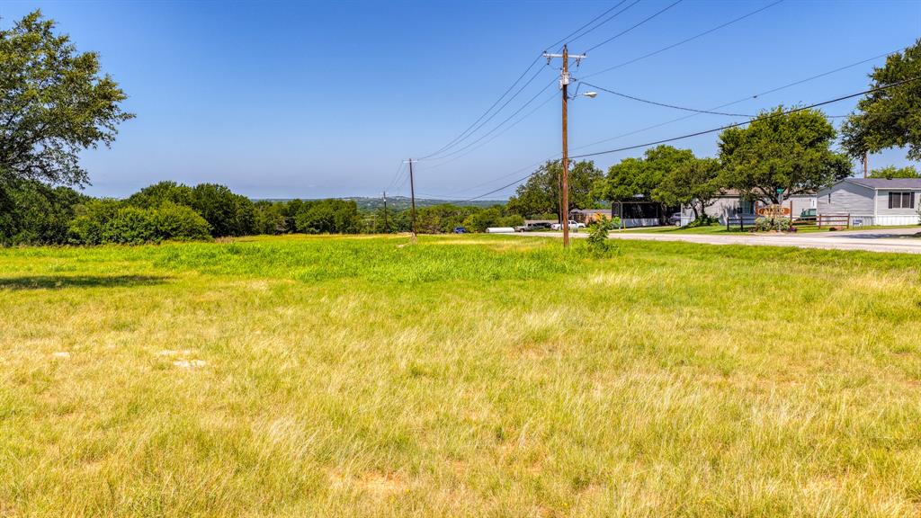 619 Old Annetta Road Aledo, TX 76008 - Photo 13 of 16 Expansive grass field with varied green and golden tones