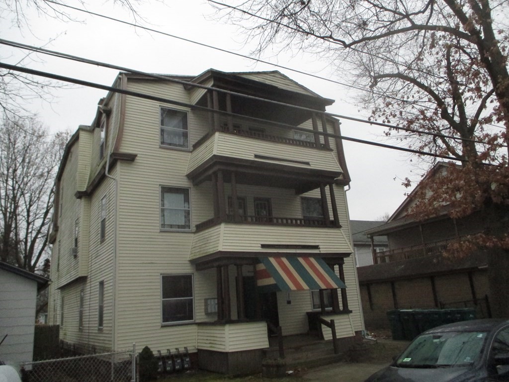 a view of a house with a car parked car