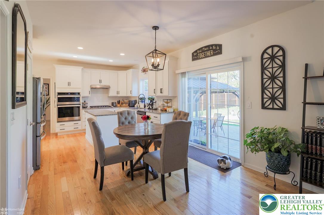 2168 Terry Road Nazareth, PA 18064 - Photo 24 of 81 a dining room with furniture potted plants and wooden floor