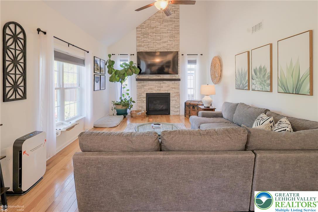 2168 Terry Road Nazareth, PA 18064 - Photo 25 of 81 a living room with furniture a flat screen tv and a fireplace