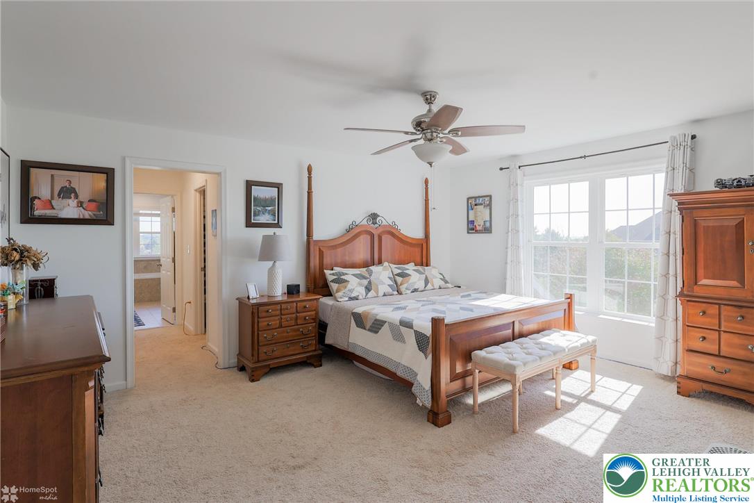 2168 Terry Road Nazareth, PA 18064 - Photo 42 of 81 a bedroom with a bed and a chandelier