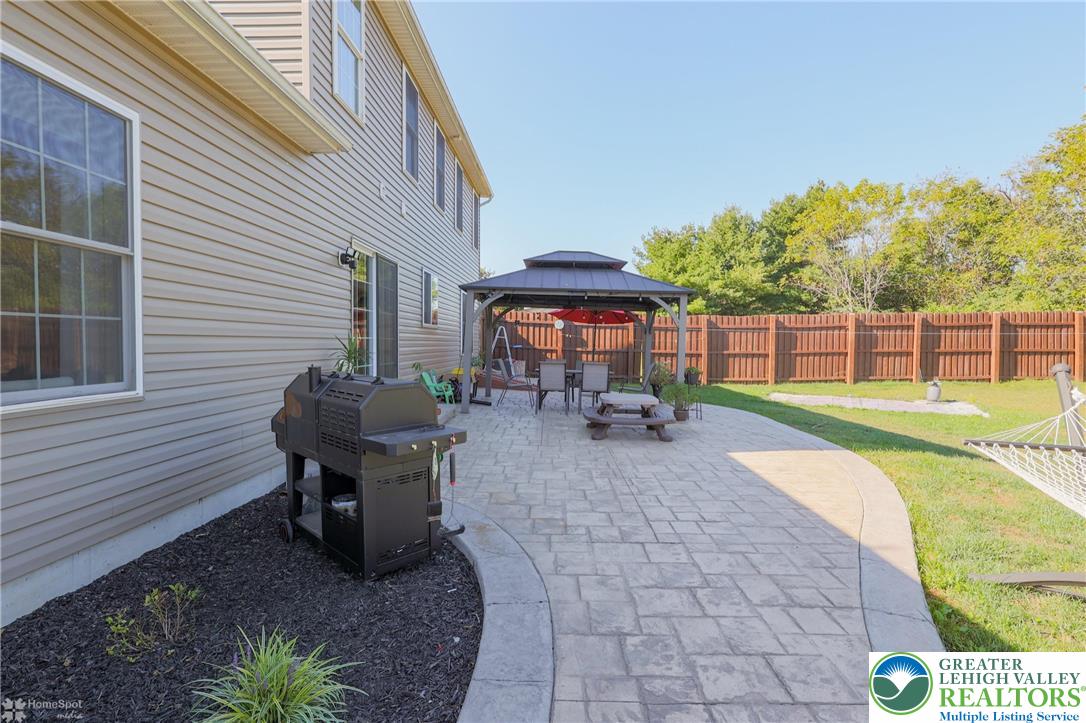2168 Terry Road Nazareth, PA 18064 - Photo 69 of 81 a view of a chair and table in backyard of the house