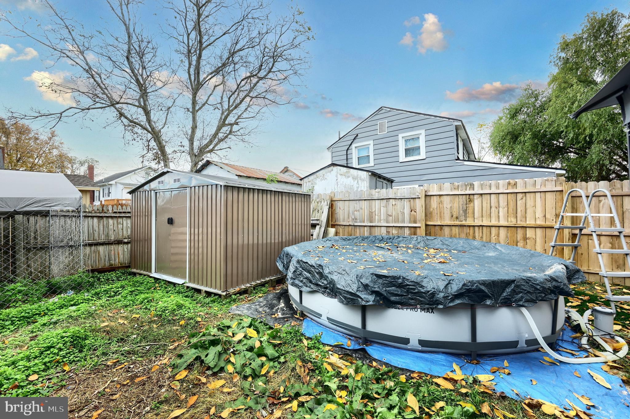 18 Beck Mill Road Hanover, PA 17331 - Photo 8 of 20 a view of a backyard with brick wall and potted plants