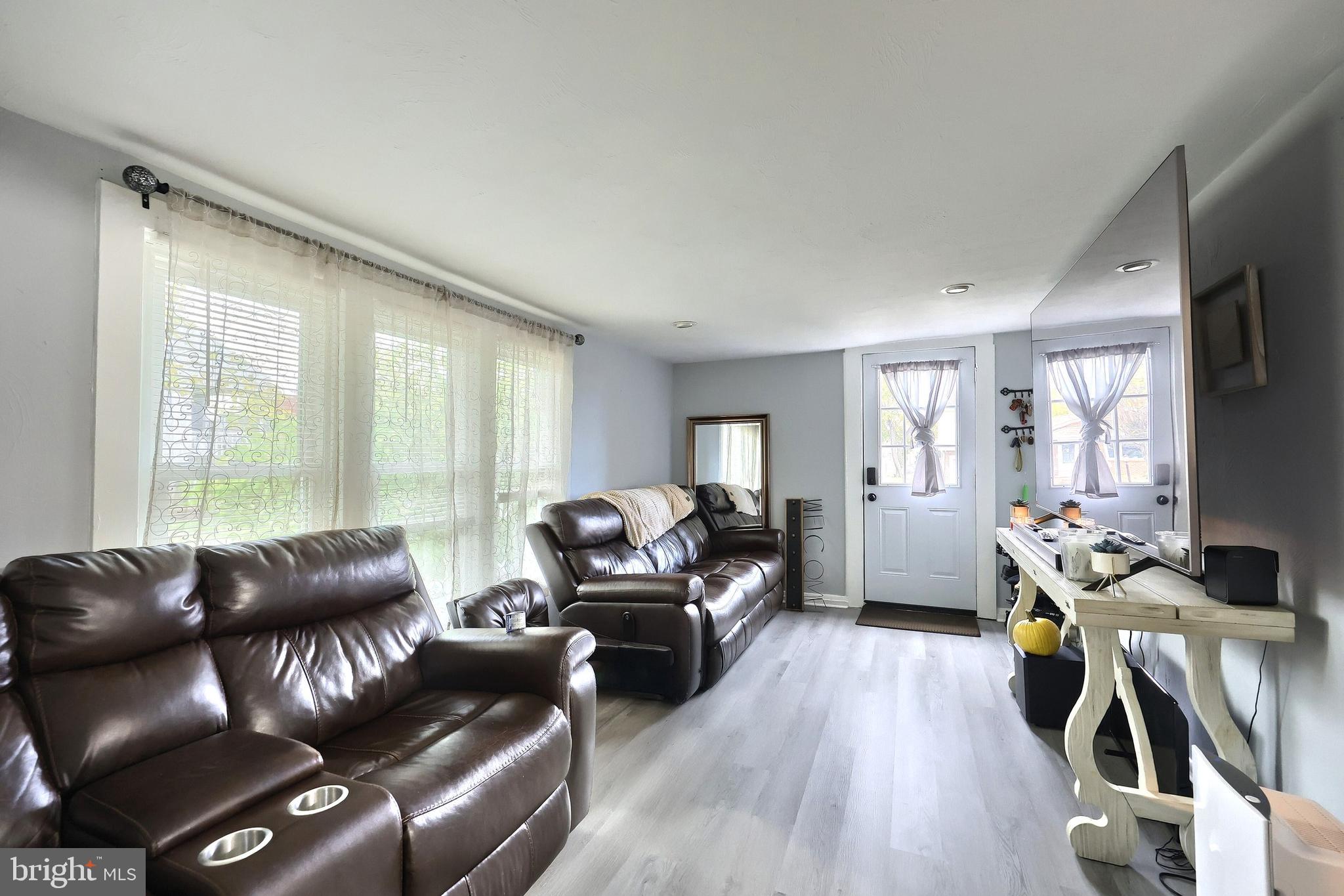 18 Beck Mill Road Hanover, PA 17331 - Photo 10 of 20 a living room with furniture a wooden floor and a large window
