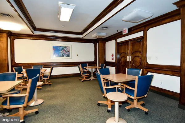 a room with gym equipment and windows