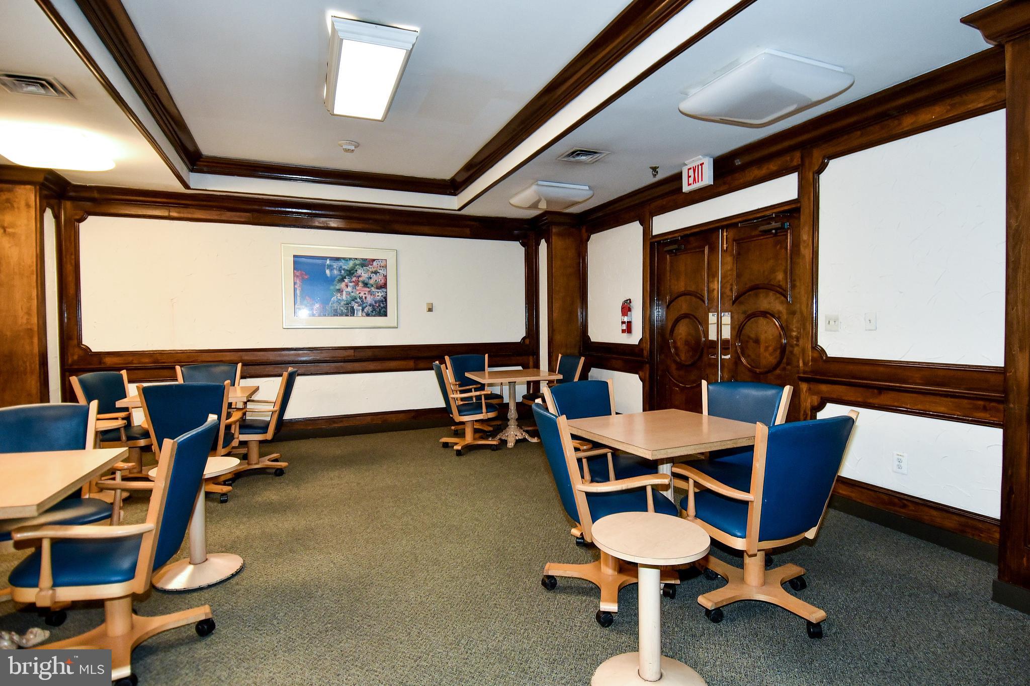 5225 Pooks Hill Road, Unit 1214N Bethesda, MD 20814 - Photo 12 of 26 a room with gym equipment and windows