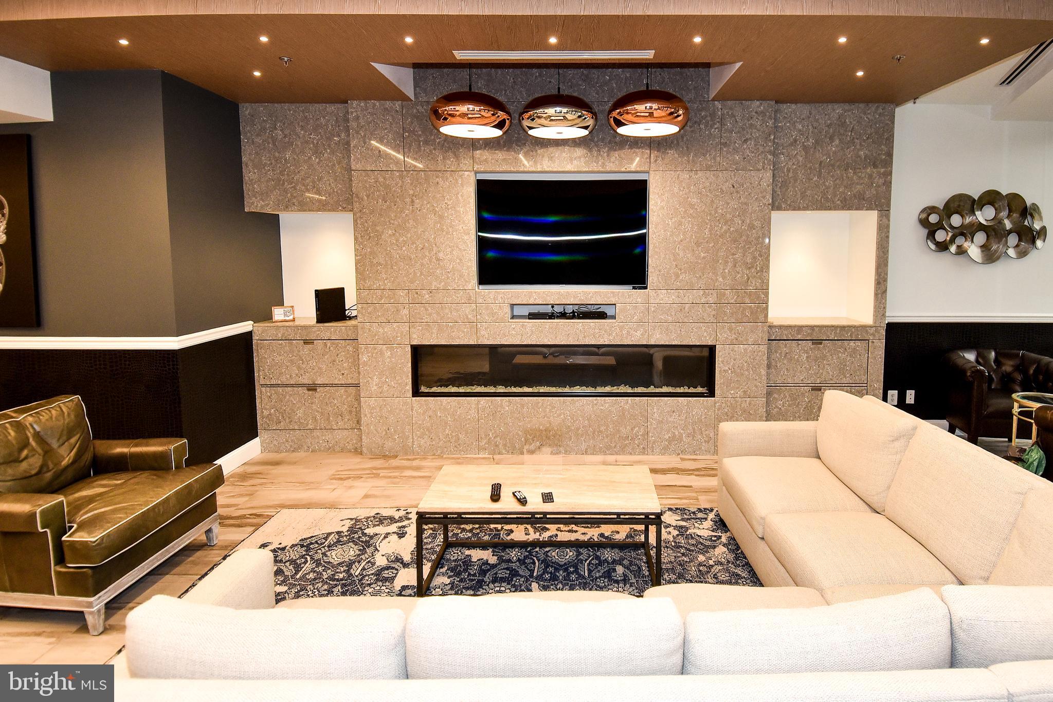 5225 Pooks Hill Road, Unit 1214N Bethesda, MD 20814 - Photo 14 of 26 a living room with stainless steel appliances kitchen island granite countertop furniture a rug and a window