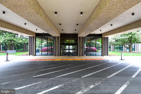 a view of a patio with a swimming pool table and chairs
