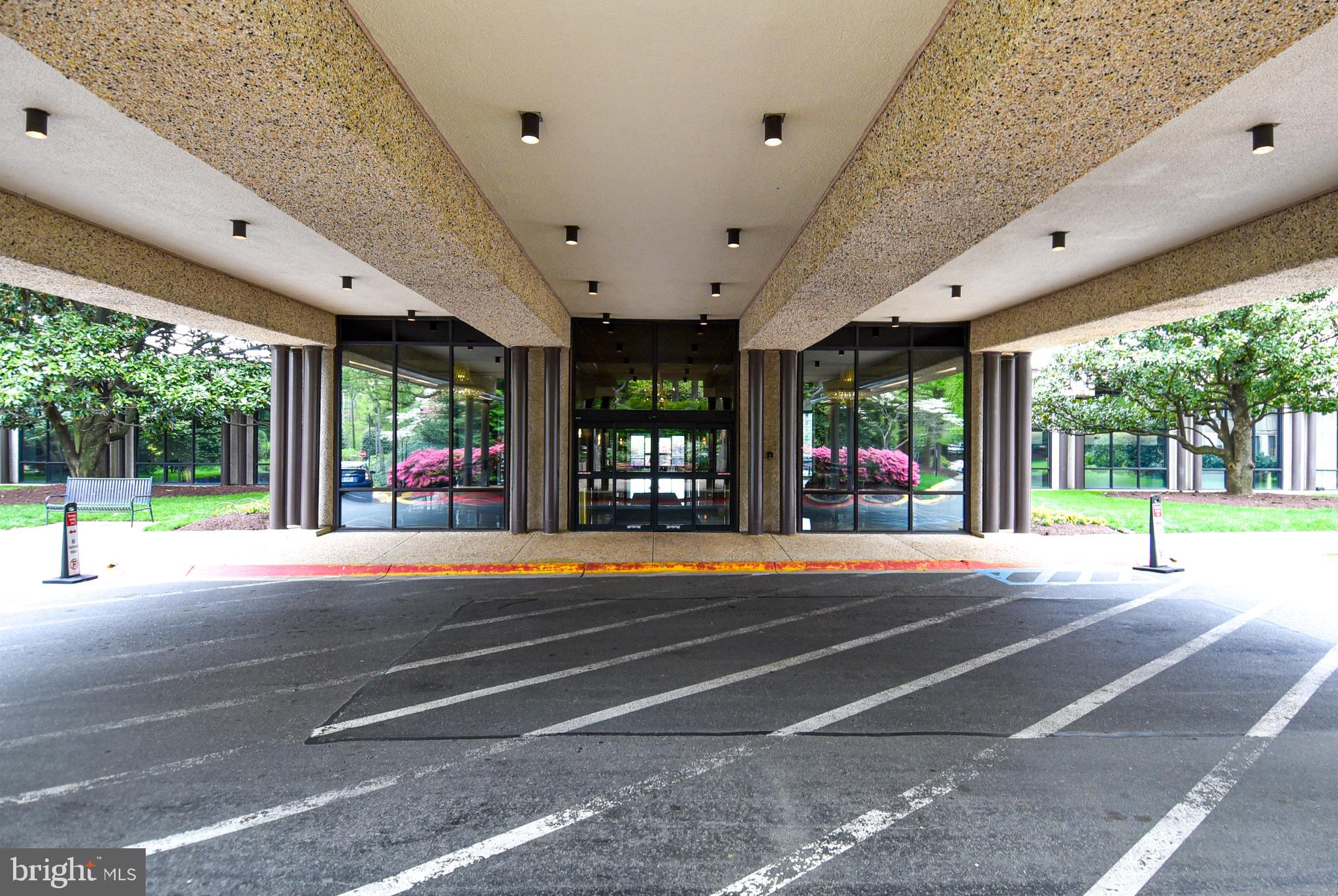 5225 Pooks Hill Road, Unit 1214N Bethesda, MD 20814 - Photo 5 of 26 a view of a patio with a swimming pool table and chairs