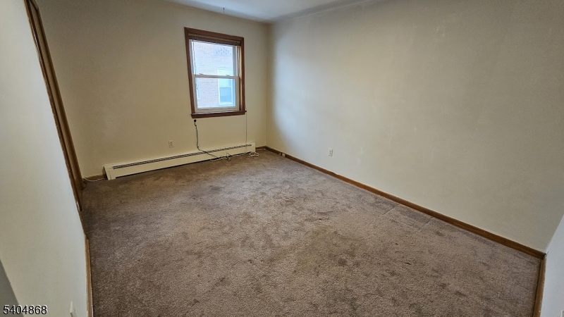 5 Passaic Avenue Nutley, NJ 07110 - Photo 11 of 12 an empty room with a window