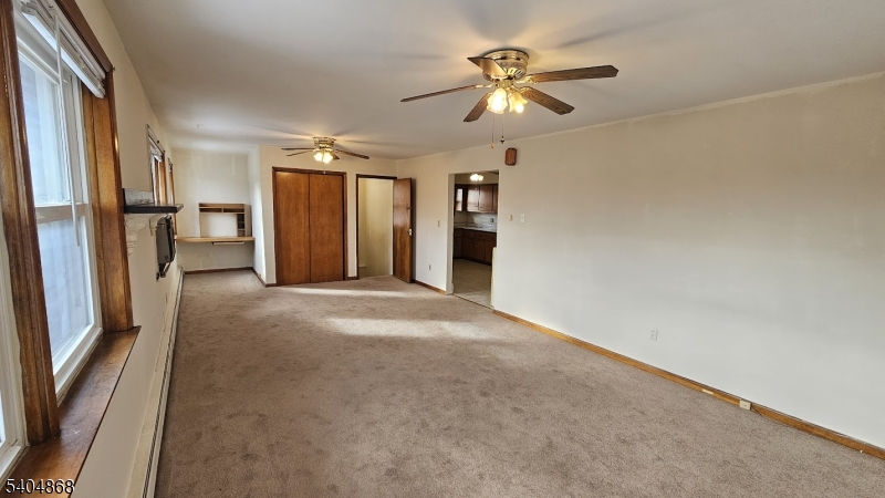 5 Passaic Avenue Nutley, NJ 07110 - Photo 2 of 12 an empty room with windows and entryway