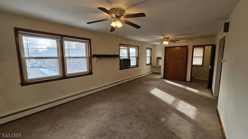 5 Passaic Avenue Nutley, NJ 07110 - Photo 3 of 12 a view of a livingroom with a ceiling fan and window