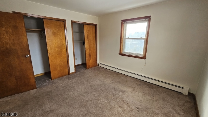5 Passaic Avenue Nutley, NJ 07110 - Photo 8 of 12 an empty room with windows
