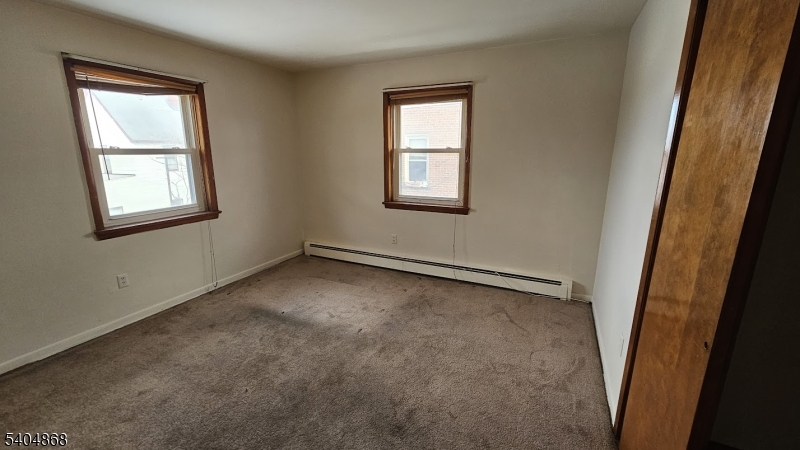 5 Passaic Avenue Nutley, NJ 07110 - Photo 10 of 12 an empty room with windows