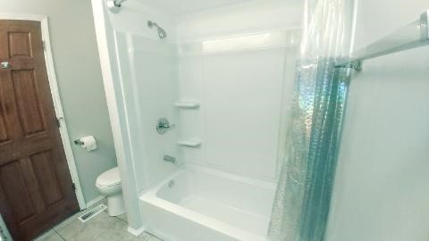 2 Tower Court Downers Grove, IL 60516 - Photo 12 of 20 a bathroom with a bathtub and a shower