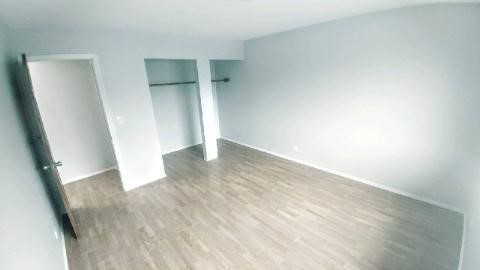 2 Tower Court Downers Grove, IL 60516 - Photo 17 of 20 an empty room with wooden floor and entrance