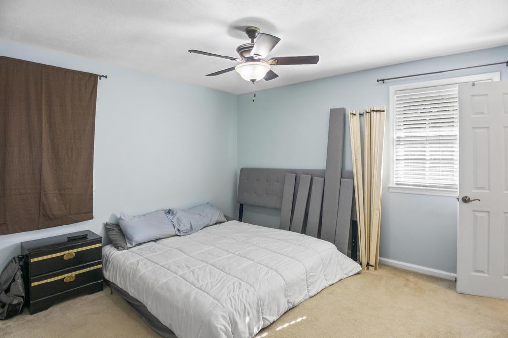 1934 Huntsman Drive Aiken, SC 29803 - Photo 13 of 19 a bedroom with a bed and a chandelier