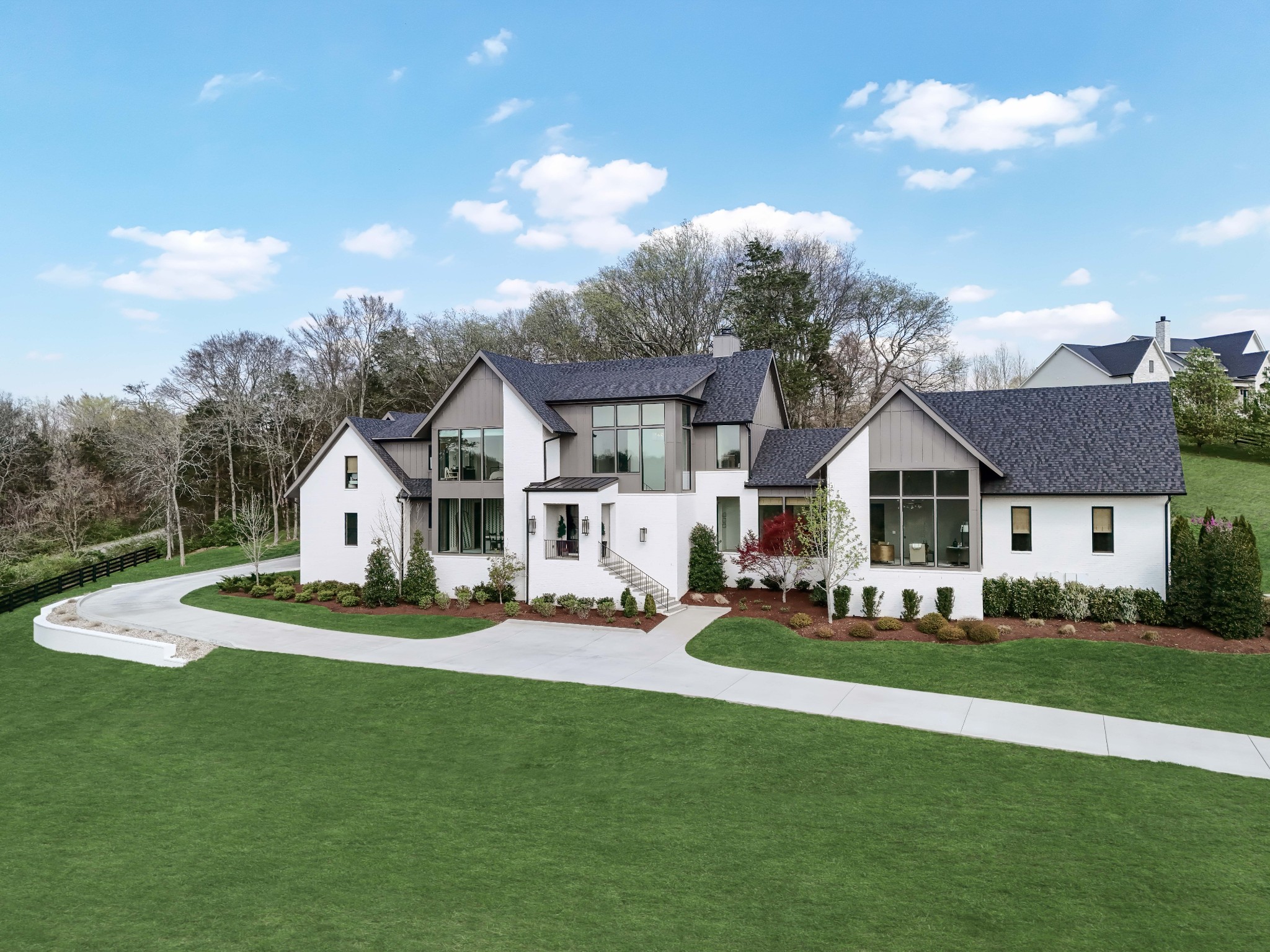 4472 South Carothers Road Franklin, TN 37064 - Photo 38 of 44 a front view of a house with a garden and trees