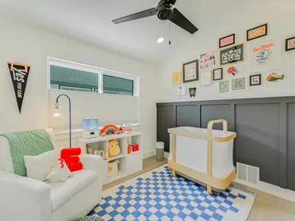 a bathroom with a sink a large mirror and a toilet